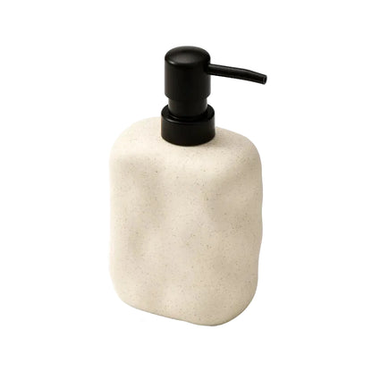  Sand Form wabi-sabi ceramic soap dispenser with matte black pump, angled front view on white background showing sandy stone texture and organic form