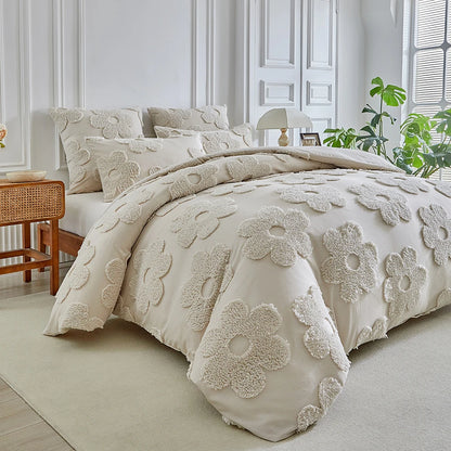 "Daisy Field" tufted cotton duvet cover set with matching pillowcases styled on a king bed in a bright Scandinavian-inspired bedroom