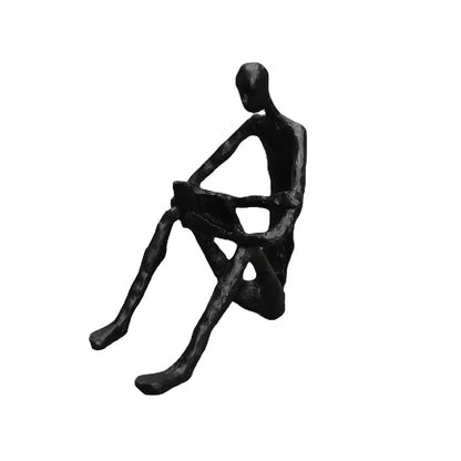 Abstract seated reader sculpture in matte black metal, shown with dimensions of 17 cm tall, 15 cm deep and 10 cm wide