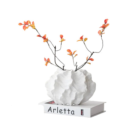 : Crinkle Cloud white ceramic vase styled with orange autumn branches on white book, white background