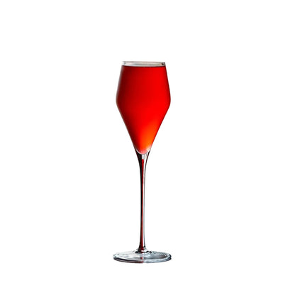  "Ink Line" geometric crystal wine glass with red stem filled with a red drink on white background, bold geometric design — CL House Drinkware collection