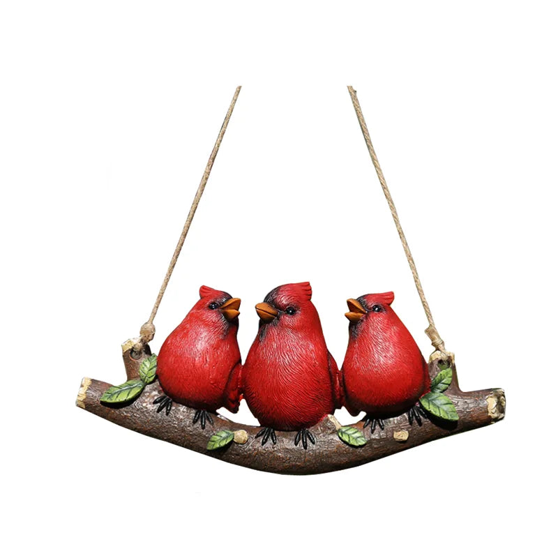 Wild Perch" hand-painted resin red cardinal trio perched on hanging branch ornament with jute rope, garden decoration, white background