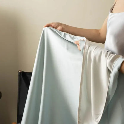 Close-up of Mist Blue 100% Tencel cooling summer blanket showing silky smooth fabric texture