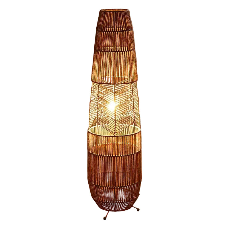 "Weave & Glow" rattan floor lamp full view showing handwoven herringbone pattern and sculptural silhouette on white background