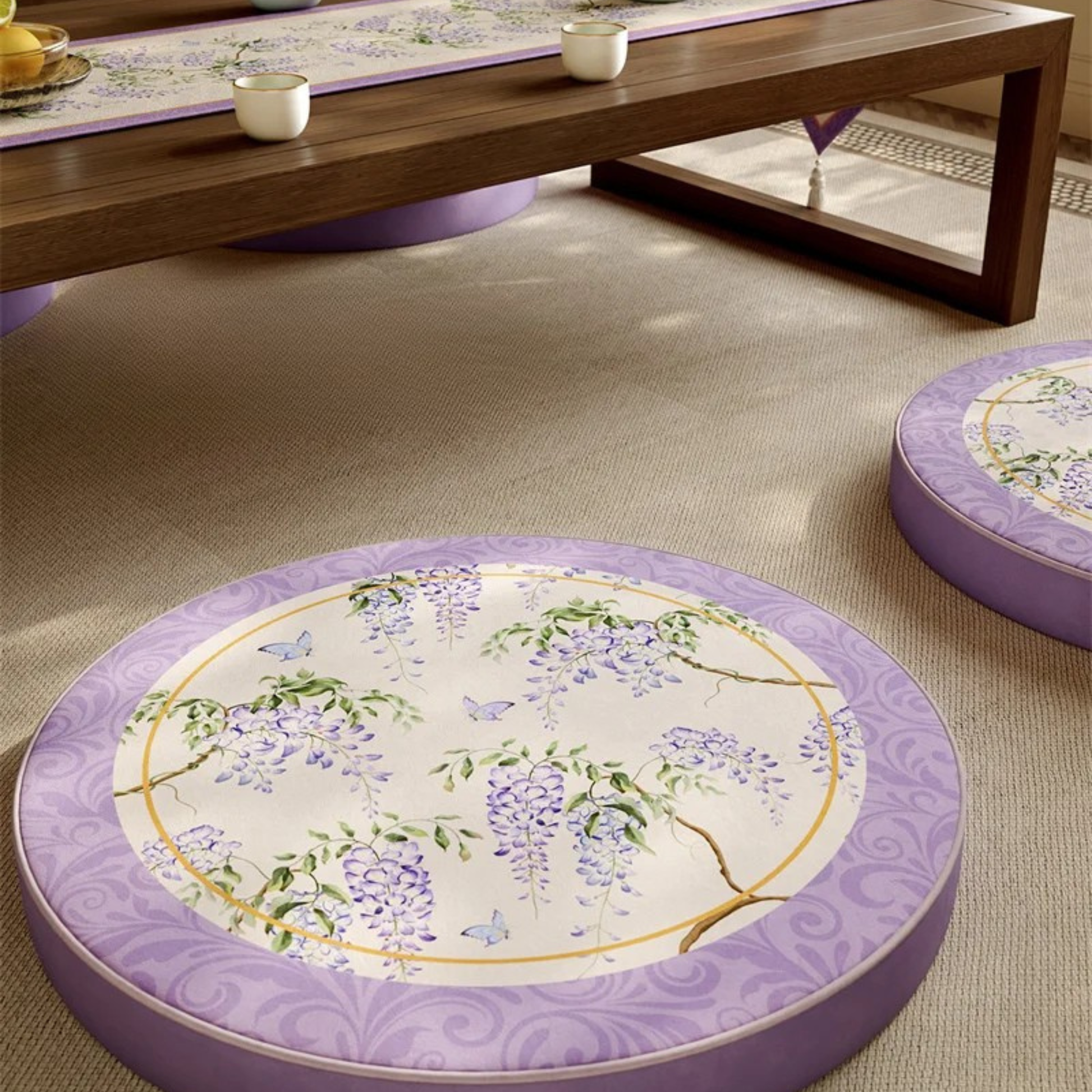 Two "Garden Scroll" zafu meditation cushions in lilac velvet on natural tatami floor, japandi interior with wooden low table — CL House