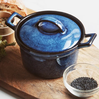 Midnight Blue ceramic casserole with lid, styled on wooden chopping board with artisan bread and black sesame seeds in glass dish — Stone Vessel by CL House