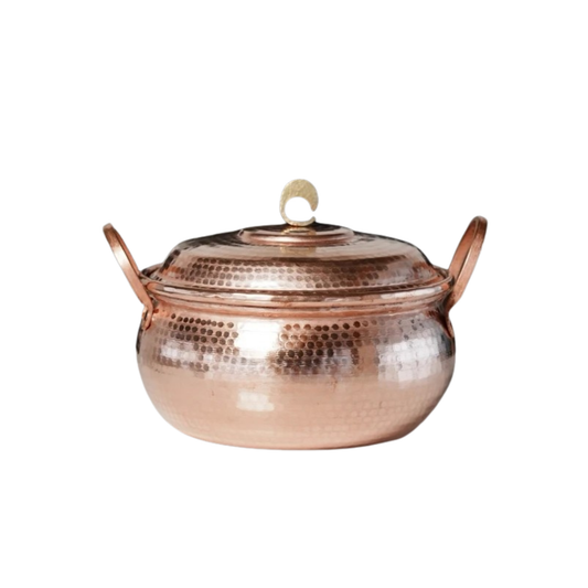 Copper Cauldron handmade pure copper stew pot with domed lid and arched copper handles on white background, showing the full hammer-textured rose-gold body and brass crescent lid knob