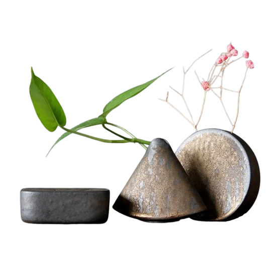 "Silent Mountain" Stoneware Vase — full set of three ceramic forms in volcanic bronze glaze with dried flowers and green stems, wabi-sabi ikebana decor