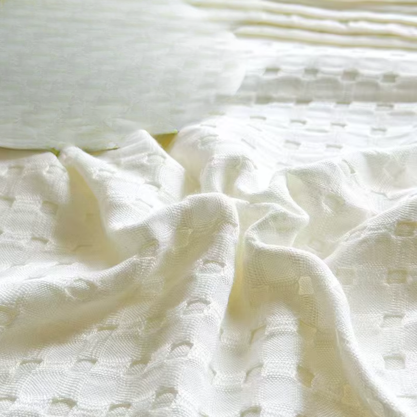 "Extreme close-up of 100% Bamboo Fibre waffle-texture cooling blanket in Ivory White — showing the soft, breathable honeycomb weave and silky smooth finish of the bamboo fabric"