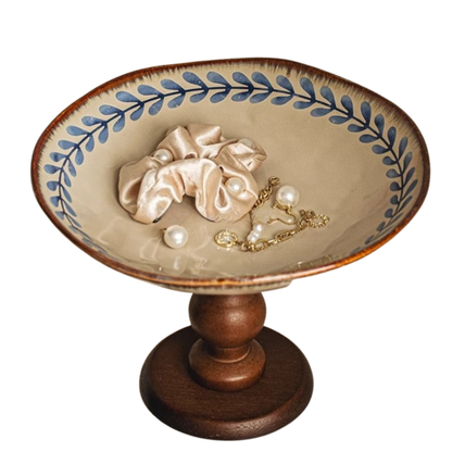 "Blue Botanics" Willow Leaf ceramic pedestal stand styled with a silk scrunchie, pearl beads and a gold chain — lifestyle detail shot showing versatile everyday use