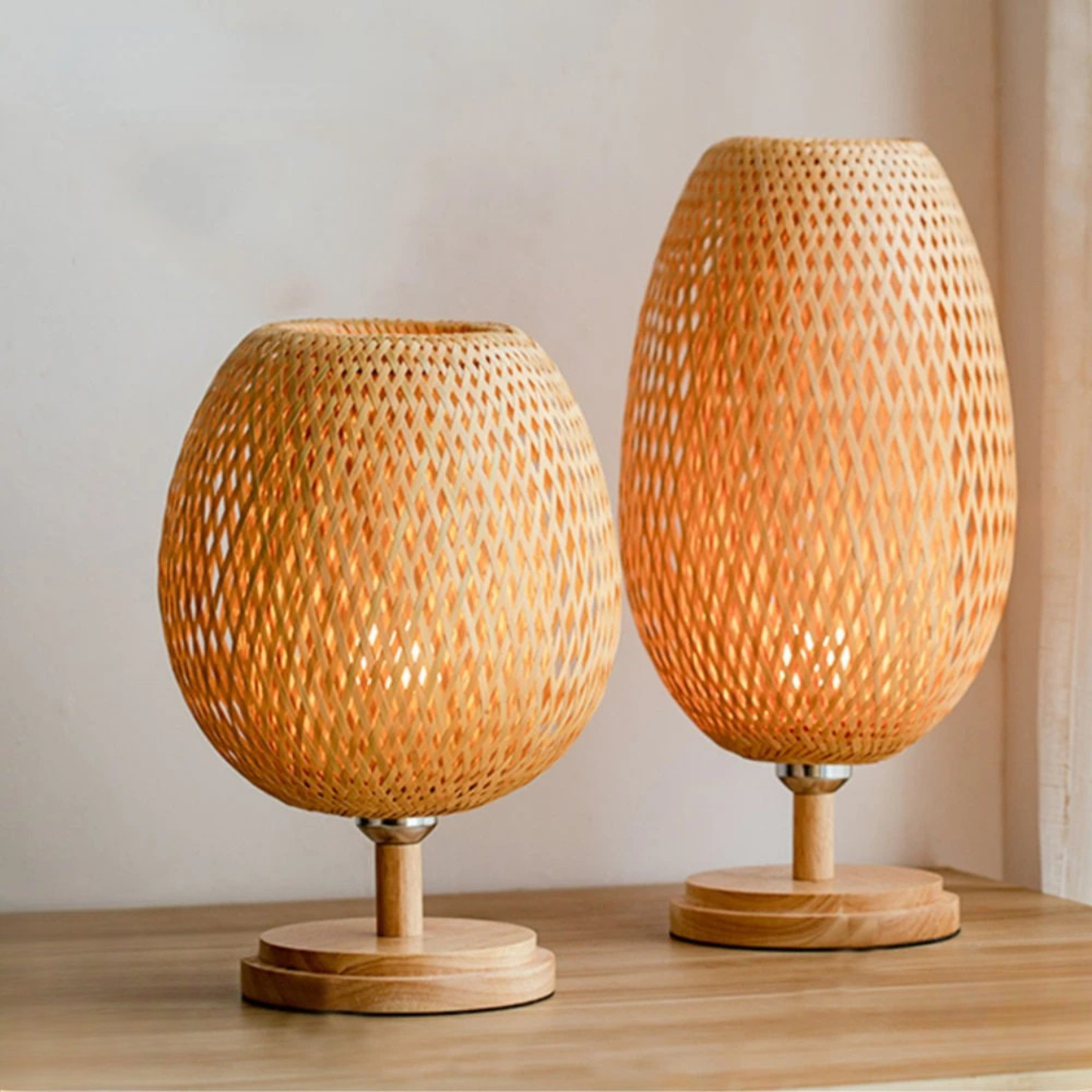 Tall woven bamboo table lamp with oval shade and round wooden base, shown against a white background — "Woven Glow" Large 18 × 48cm by CL House