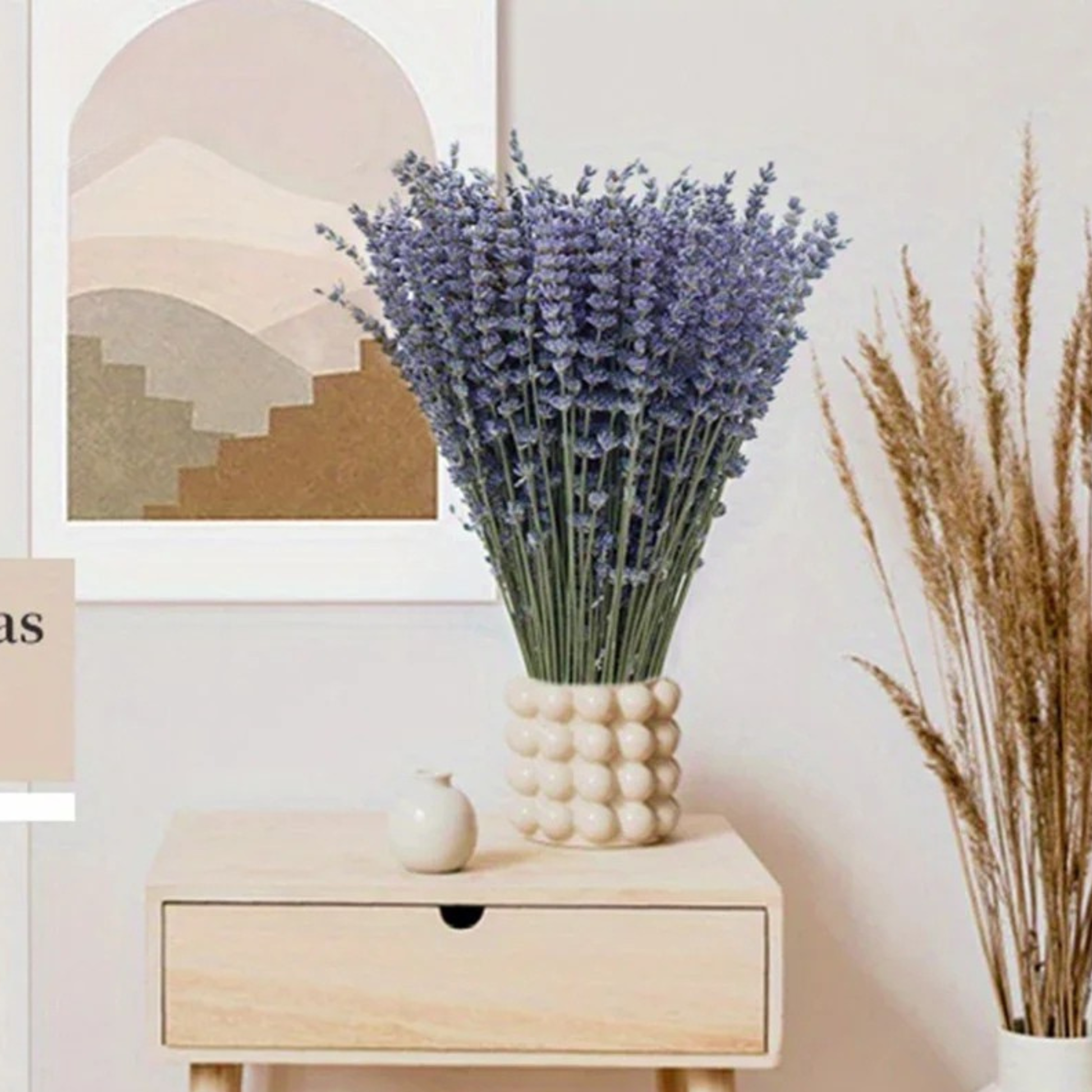 "Lavender Fields" dried lavender bouquet in a white bubble ceramic vase, styled on a wooden bedside drawer with pampas grass and abstract art print on the background